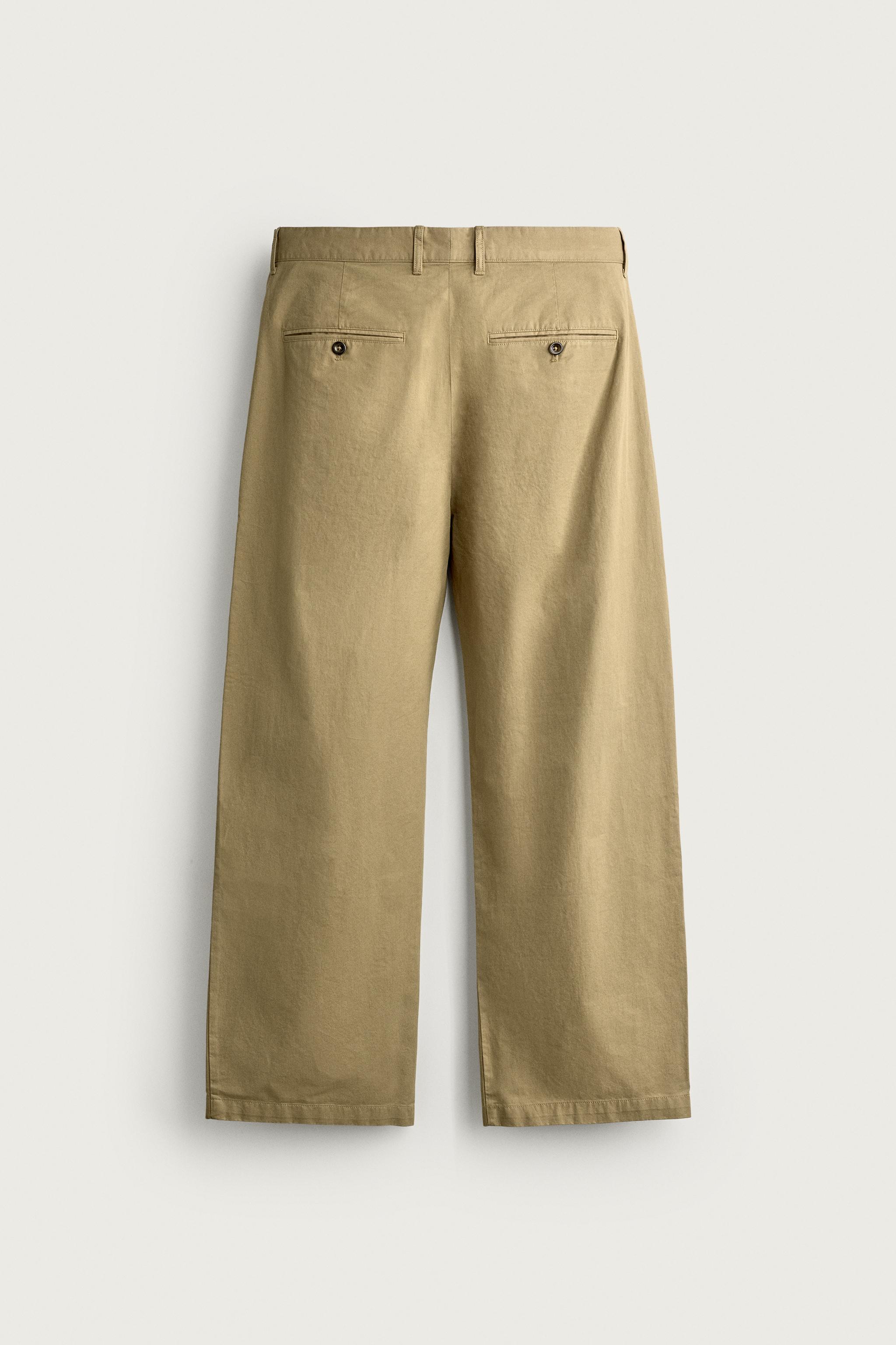 PLEATED CHINO PANTS